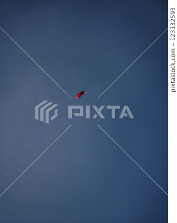 Paraglider flying in blue sky over chamonix, french alps Paraglider flying in blue sky over chamonix, french alps 123132593