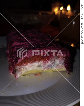 Dressed herring salad garnished with beetroot for christmas dinner in prague Dressed herring salad garnished with beetroot for christmas dinner in prague 123132595