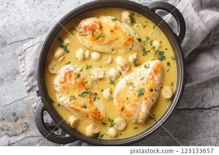 Tasty Chicken Diane with creamy brandy sauce and mushrooms closeup in the skillet. Horizontal top view Tasty Chicken Diane with creamy brandy sauce and mushrooms closeup in the skillet. Horizontal top view 123133657