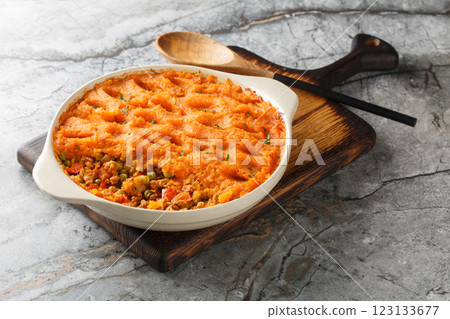 Baked Sweet Potato Shepherd's Pie with mince and fresh vegetables close-up in baking dish. Horizontal 123133677