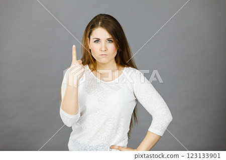 Attractive woman having angry frustrated face expression Attractive woman having angry frustrated face expression 123133901