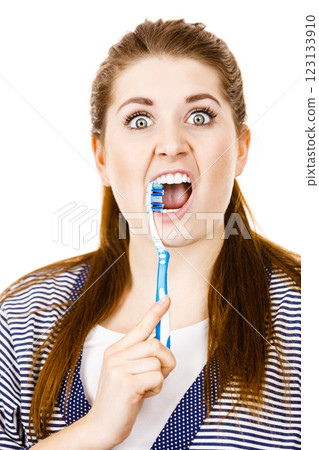 Woman brushing cleaning teeth. 123133910