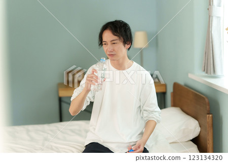 Middle-aged men drinking water 123134320