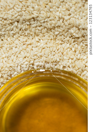 Unrefined cold pressed sesame oil in a glass bowl. Unrefined cold pressed sesame oil in a glass bowl. 123134765