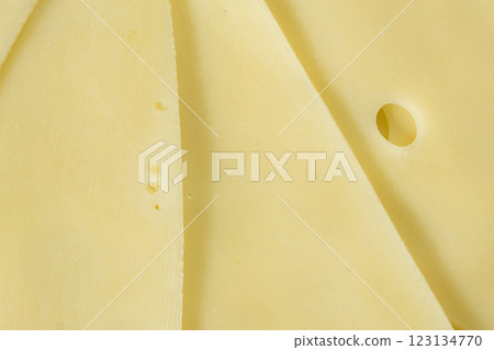 Semi-hard cheese close-up, thin slices, top view 123134770