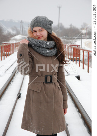 Winter fashion on snowy railroad bridge Winter fashion on snowy railroad bridge 123135004