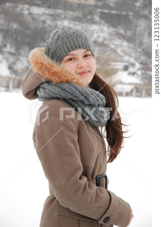 Winter fashion portrait of woman in snowy landscape Winter fashion portrait of woman in snowy landscape 123135006