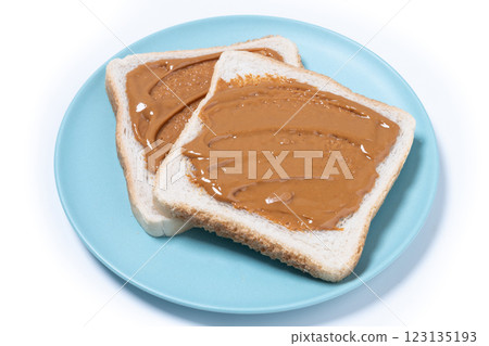 Bread toast with peanut butter cream isolated on white background Bread toast with peanut butter cream isolated on white background 123135193