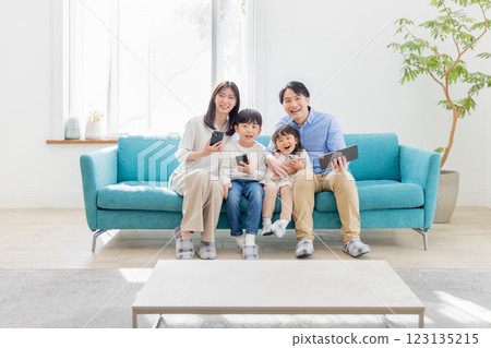 Family using tablets, gadgets and smartphones 123135215
