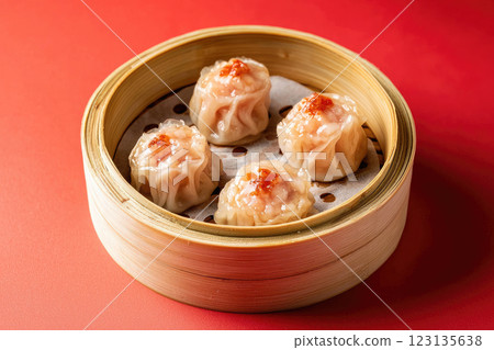 Siu mai in dim sum bamboo steamer on red background. traditional chinese dish 123135638
