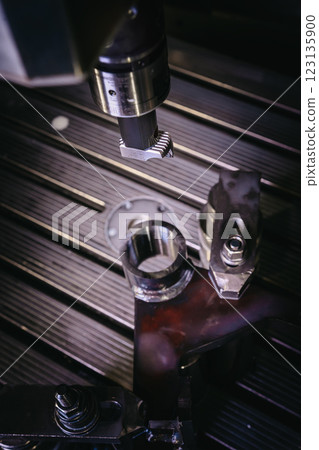 Precision CNC control in production, metalworking Precision CNC control in production, metalworking 123135900