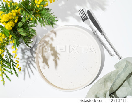 Festive table setting for spring celebration of women's day, wedding or mother's day with mimosa Festive table setting for spring celebration of women's day, wedding or mother's day with mimosa 123137113