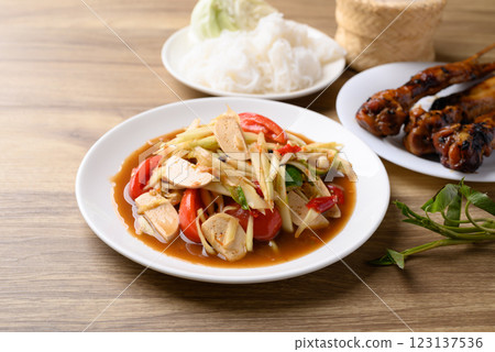 Thai food (Som Tum), Spicy papaya salad with pork sausage Thai food (Som Tum), Spicy papaya salad with pork sausage 123137536