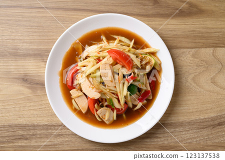 Thai food (Som Tum), Spicy papaya salad with pork sausage, Local Thai food, Table top view Thai food (Som Tum), Spicy papaya salad with pork sausage, Local Thai food, Table top view 123137538