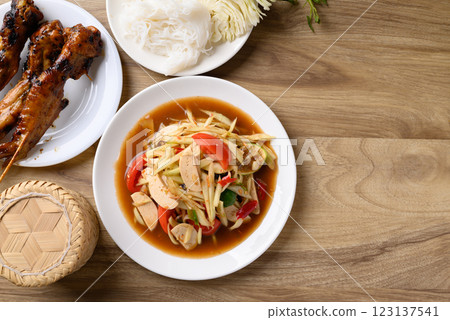 Thai food (Som Tum), Spicy papaya salad with pork sausage Thai food (Som Tum), Spicy papaya salad with pork sausage 123137541