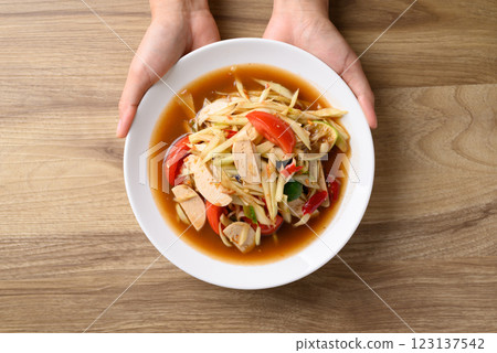 Thai food (Som Tum), Spicy papaya salad with pork sausage  123137542