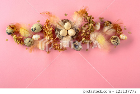 Easter composition with quail eggs, feathers, and dried flowers. 123137772