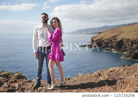 Couple embracing on cliff overlooking ocean in madeira island, portugal 123138206