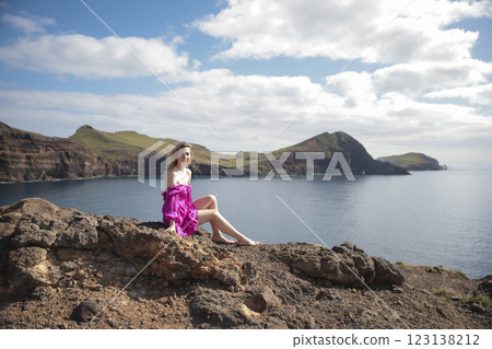 Influencer posing on volcanic rocks at ponta de s o louren o in madeira island, portugal 123138212
