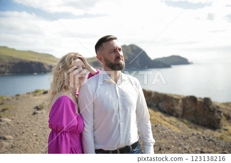 Couple enjoying breathtaking ocean view from madeira island clifftop 123138216