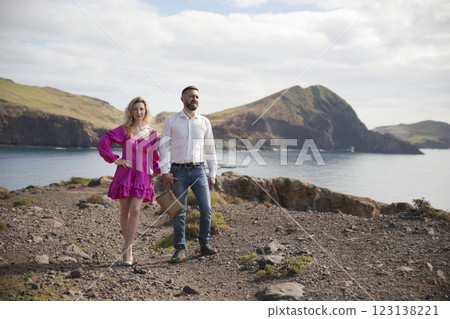 Couple holding hands enjoying ponta de s o louren o landscape in madeira island, portugal Couple holding hands enjoying ponta de s o louren o landscape in madeira island, portugal 123138221