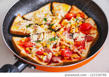 Pizza toast made in a frying pan with cheese 123138799