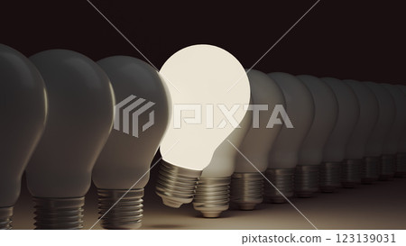 Among a row of light bulbs, one glows brighter, illustrating an idea concept and career individuality. 123139031