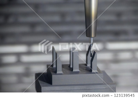 The CNC milling machine cutting the graphite electrode parts. The CNC milling machine cutting the graphite electrode parts. 123139545