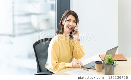 Smiling woman/businesswoman talking on smartphone Smiling woman/businesswoman talking on smartphone 123139726