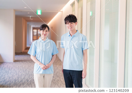 Male and female staff working at a care facility 123140209