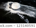 White flour and rolling pin on a black background. Toned. 123140591