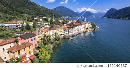 Switzerland scenic places, Lugano lake, beautiful colorful village Brusino Arsizio (canton Ticino) aerial panoramic view Switzerland scenic places, Lugano lake, beautiful colorful village Brusino Arsizio (canton Ticino) aerial panoramic view 123140887