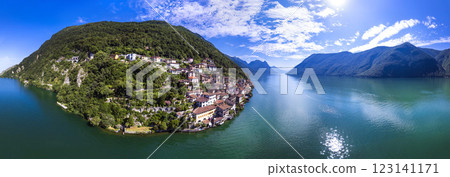 most beautiful traditional villages of Switzerland - scenic Gandria with colorful houses in lake Lugano . Border with Italy. Aerial drone panoramic view most beautiful traditional villages of Switzerland - scenic Gandria with colorful houses in lake Lugano . Border with Italy. Aerial drone panoramic view 123141171