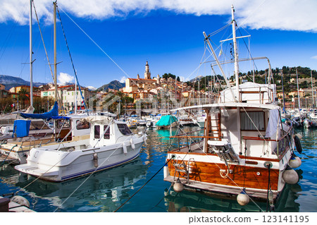 Mentone - beautiful coastal town resort in French riviera. view of marine with sail boats,yachts  and colorful houses. Cote d'azure, Alpes-maritimes, France 123141195