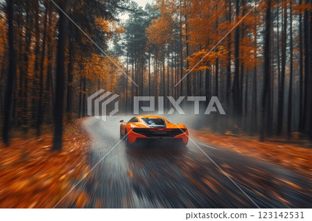 orange car on the road in the autumn forest. speed motion blur effect 123142531