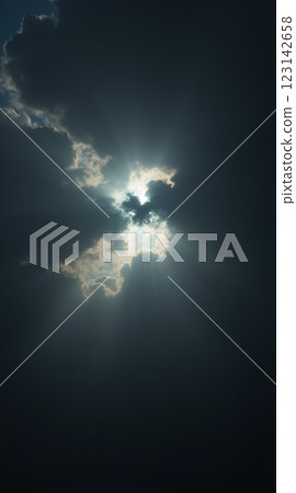 Stunning Phone Wallpaper of Radiant Sunlight Breaking Through Dark Clouds 123142658