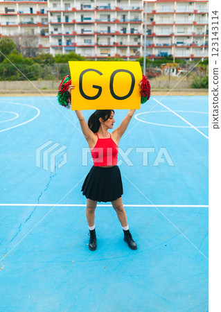 Cheerleader Girl Cheers Her Heart Team With Go Yellow Signboard Cheerleader Girl Cheers Her Heart Team With Go Yellow Signboard 123143114