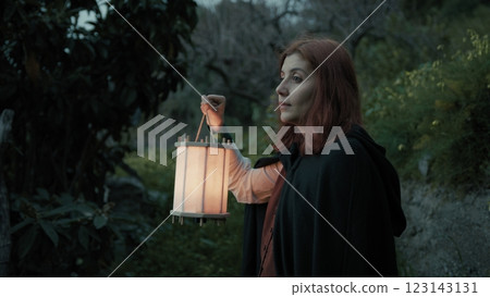 Sad Woman Getting Lost In The Forest At Night With A Lantern Sad Woman Getting Lost In The Forest At Night With A Lantern 123143131