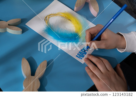 Making Easter egg from cotton rope and feather Gift Easter idea. Do it yourself instruction postcard eco-friendly decoration. Making handmade art presents children's diy projects. Spring holiday Making Easter egg from cotton rope and feather Gift Easter idea. Do it yourself instruction postcard eco-friendly decoration. Making handmade art presents children's diy projects. Spring holiday 123143182