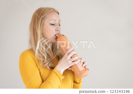 Portrait of female musician playing on traditional clay flute. Woman playing ocarina Portrait of female musician playing on traditional clay flute. Woman playing ocarina 123143196
