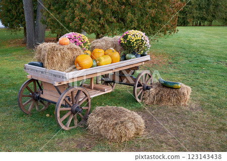 Rustic Fall Display with Pumpkins and Hay Bales 123143438