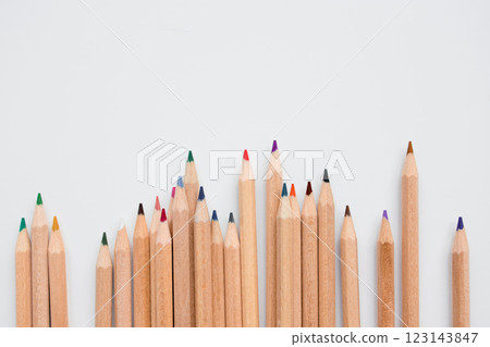 Colorful wooden pencils arranged in line on light background for art and design inspiration Colorful wooden pencils arranged in line on light background for art and design inspiration 123143847