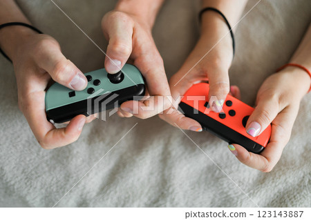 Hands using game controller. Playing video games Hands using game controller. Playing video games 123143887
