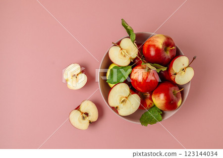Bowl with tasty fresh red apples on pink background. Harvesting apples.Top view, flat lay, copy space. Bowl with tasty fresh red apples on pink background. Harvesting apples.Top view, flat lay, copy space. 123144034