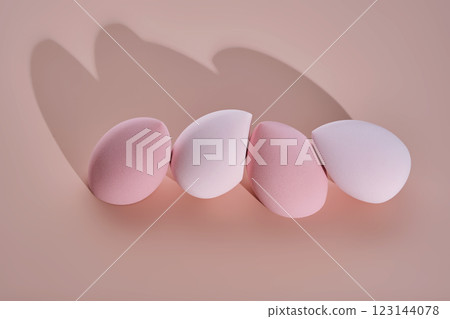 A set of makeup sponges on a pink background. A set of makeup sponges on a pink background. 123144078