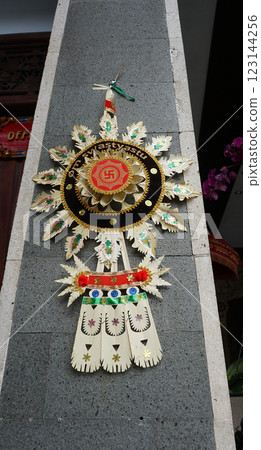 Swastika carved and drawn on a rock of temple, an ancient solar hinduism symbol in the Indian culture, India, Varanasi 123144256