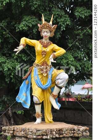 A colorful statue beautifully showcasing traditional dance attire in Ulun Danu Beratan Temple 123144260