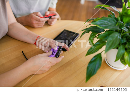 Hands using game controller. Playing video games Hands using game controller. Playing video games 123144503