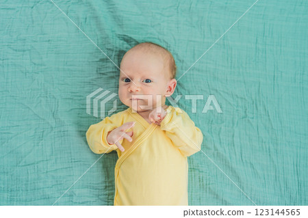 A newborn baby rests peacefully on a soft muslin swaddle, feeling comforted and secure. A tender moment of early childhood, warmth, and tranquility, symbolizing gentle care and a nurturing environment A newborn baby rests peacefully on a soft muslin swaddle, feeling comforted and secure. A tender moment of early childhood, warmth, and tranquility, symbolizing gentle care and a nurturing environment 123144565