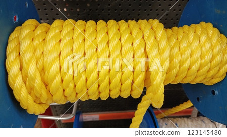 A Bright Yellow Rope is Proudly Displayed on a Shelf at the Local Hardware Store 123145480